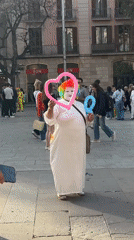 Street dancing and market activity enliven Barcelona square
