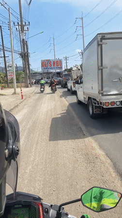 Motor scooter records street traffic in Chalong, Thailand