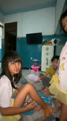 Two girls in hallway, one wearing Belle character clothing