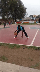 Young people play basketball on outdoor court