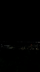 Nighttime views over Silistra from a grassy hillside overlook