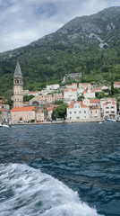 Boat passenger films scenic view of Perast, Montenegro