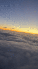 Sunset aerial view captured above clouds over Buenos Aires