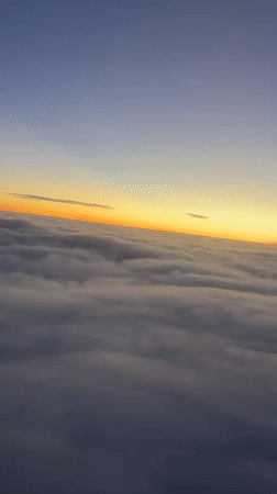 Sunset aerial view captured above clouds over Buenos Aires