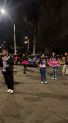 Late-night street dancing in colorful traditional dress, Arica