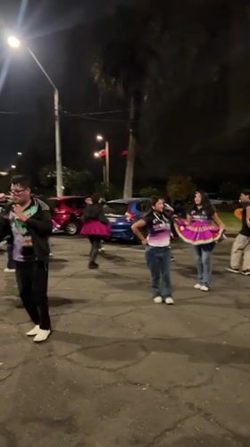 Late-night street dancing in colorful traditional dress, Arica