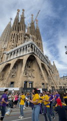 Traditional Catalan fire festival with costumed performers at Sagrada Familia
