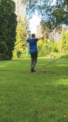 Slacklining in a Ternopil park on a summer afternoon