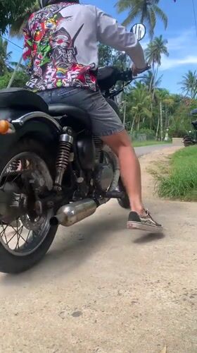 Motorcyclist spotted on tropical roads in Kabalana, Sri Lanka