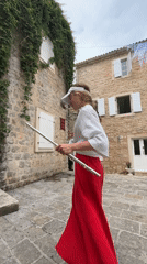 Street musician performs flute in Budva courtyard