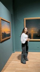 Woman leads art gallery tour in Yerevan