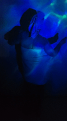 Towel-wrapped figure observed in illuminated room in Markovskii