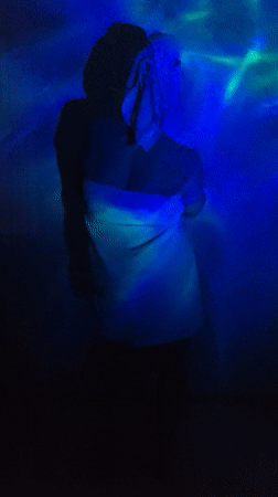 Towel-wrapped figure observed in illuminated room in Markovskii