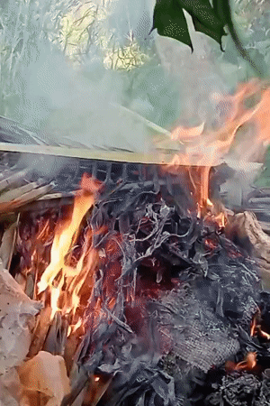 Debris fire burns in Keudekrueng amid natural vegetation