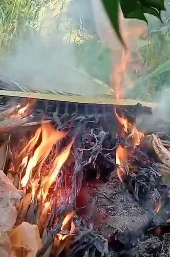 Debris fire burns in Keudekrueng amid natural vegetation
