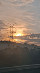 Sunrise over forested hills in Lamtamot, Indonesia
