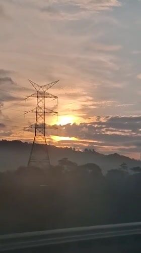 Sunrise over forested hills in Lamtamot, Indonesia