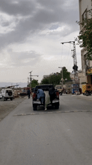 Three boys attempt to climb moving pickup truck in Quetta