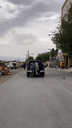 Three boys attempt to climb moving pickup truck in Quetta