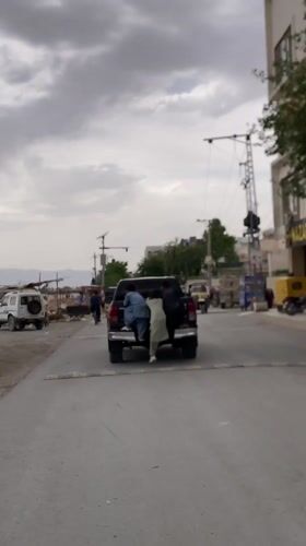 Three boys attempt to climb moving pickup truck in Quetta