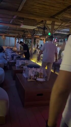 Visitor documents Dubai beach resort with surf club amenities