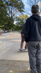Skateboarder practices at concrete park in Buenos Aires
