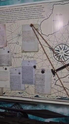 Museum visitor documents historical artifacts in Banda Aceh