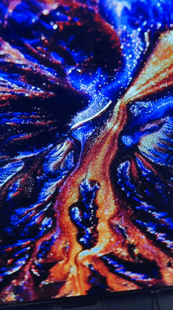 Television displays colorful abstract patterns in Sofia apartment