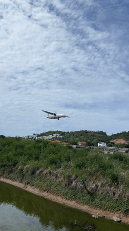 Turboprop aircraft makes landing approach over Thai countryside