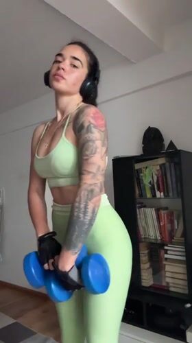 Woman performs morning workout with weights in Generalovo, Bulgaria