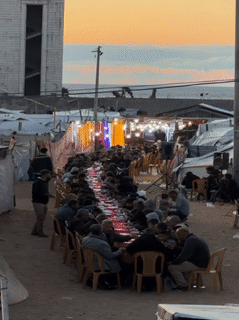 Gaza Community Holds Outdoor Ramadan Meal in Camp Setting