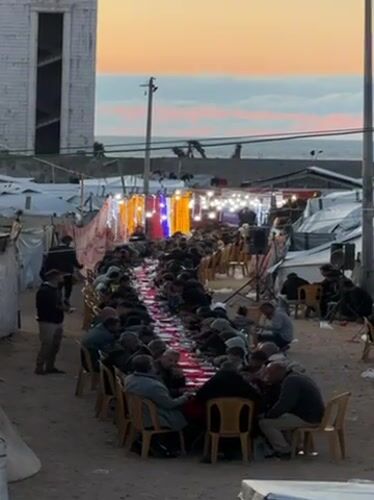 Gaza Community Holds Outdoor Ramadan Meal in Camp Setting