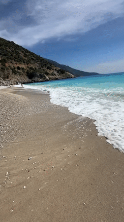 Parasailing, paragliding observed at sunny Fethiye beach resort