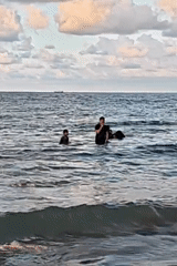 Families enjoy beach day in Lhokseumawe under cloudy skies
