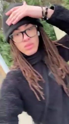 Person in black films street video in Orsay