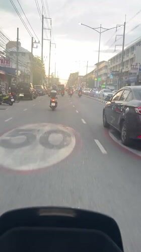 Motorcyclist records routine traffic in Pattaya City, Thailand