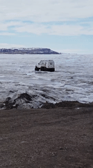 All-terrain vehicle crosses frozen waters near Russian Arctic settlement