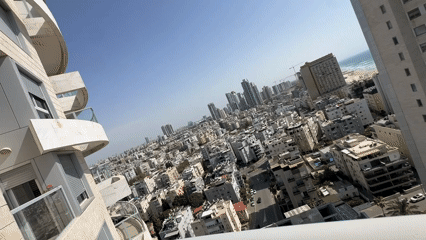 Panoramic video captures coastal city skyline on sunny day