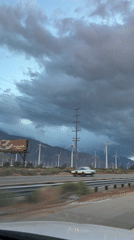 Wind turbines filmed during nighttime drive through Palm Springs