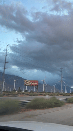 Wind turbines filmed during nighttime drive through Palm Springs