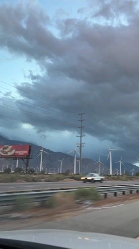 Wind turbines filmed during nighttime drive through Palm Springs