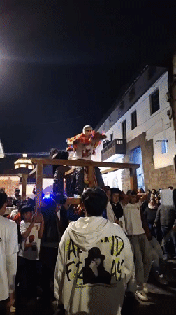 Traditional nighttime street celebration draws crowds in Cuzco, Peru