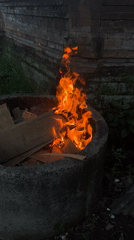 Fire pit burning and portrait filmed in North Kuta