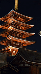 Nighttime photography captures illuminated Senso-ji Temple and Tokyo Skytree