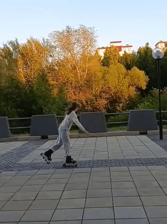 Rollerblading in a Petrozavodsk plaza at golden hour