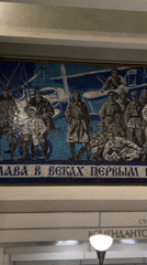 Morning commuters and military mosaic documented at Petersburg metro