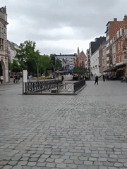 Afternoon stroll documented through Leuven's historic cobblestone squares