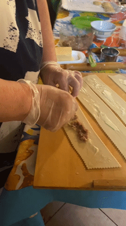 Handmade pasta being prepped on a wooden board in Silvi