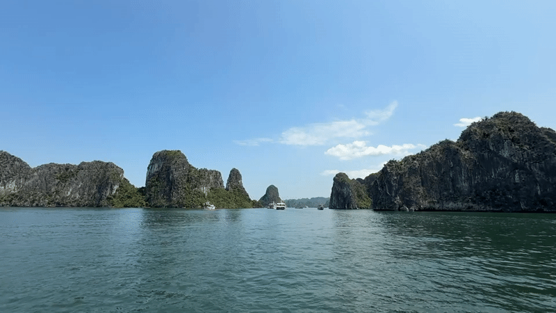 Tourists capture scenic Ha Long Bay views on sunny morning