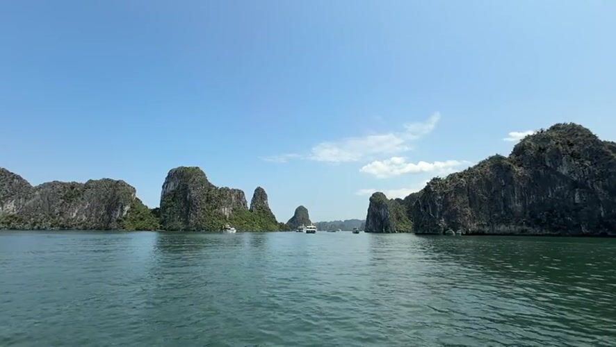 Tourists capture scenic Ha Long Bay views on sunny morning